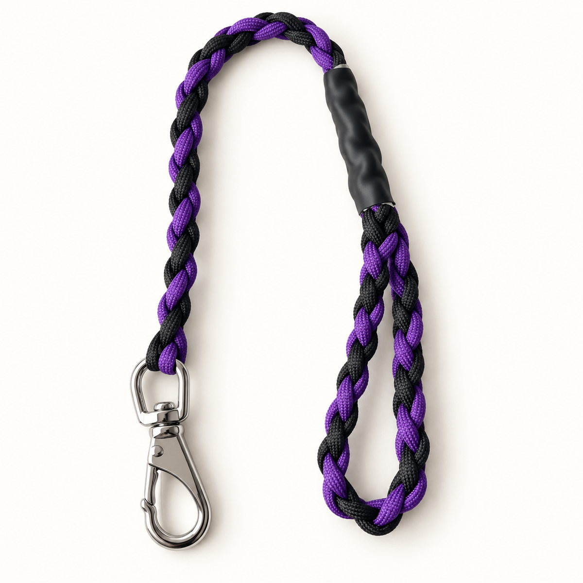 A braided pet leash with a purple and black woven strap, a black rubberized grip, and a silver metal clasp, shown on a plain white background.
